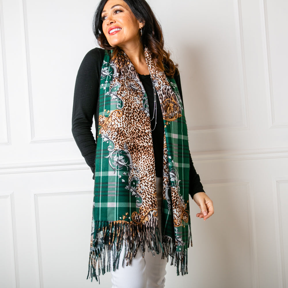 The Austin scarf in dark green worn by a model 